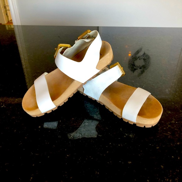Michael Kors white sandals.